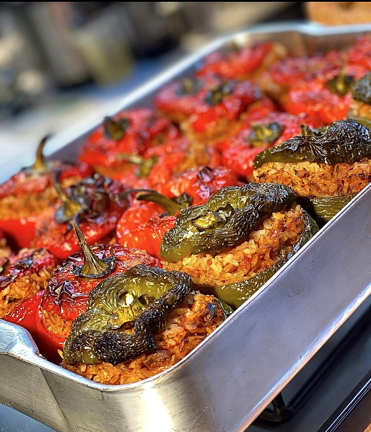 A tray of stuffed peppers and tomatoes